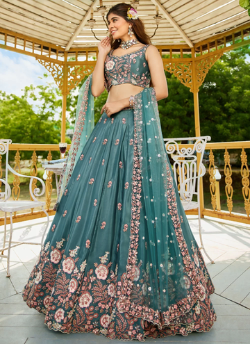Party wear Peacock colored Satin fully embroidered lehenga choli with sequin zari work.